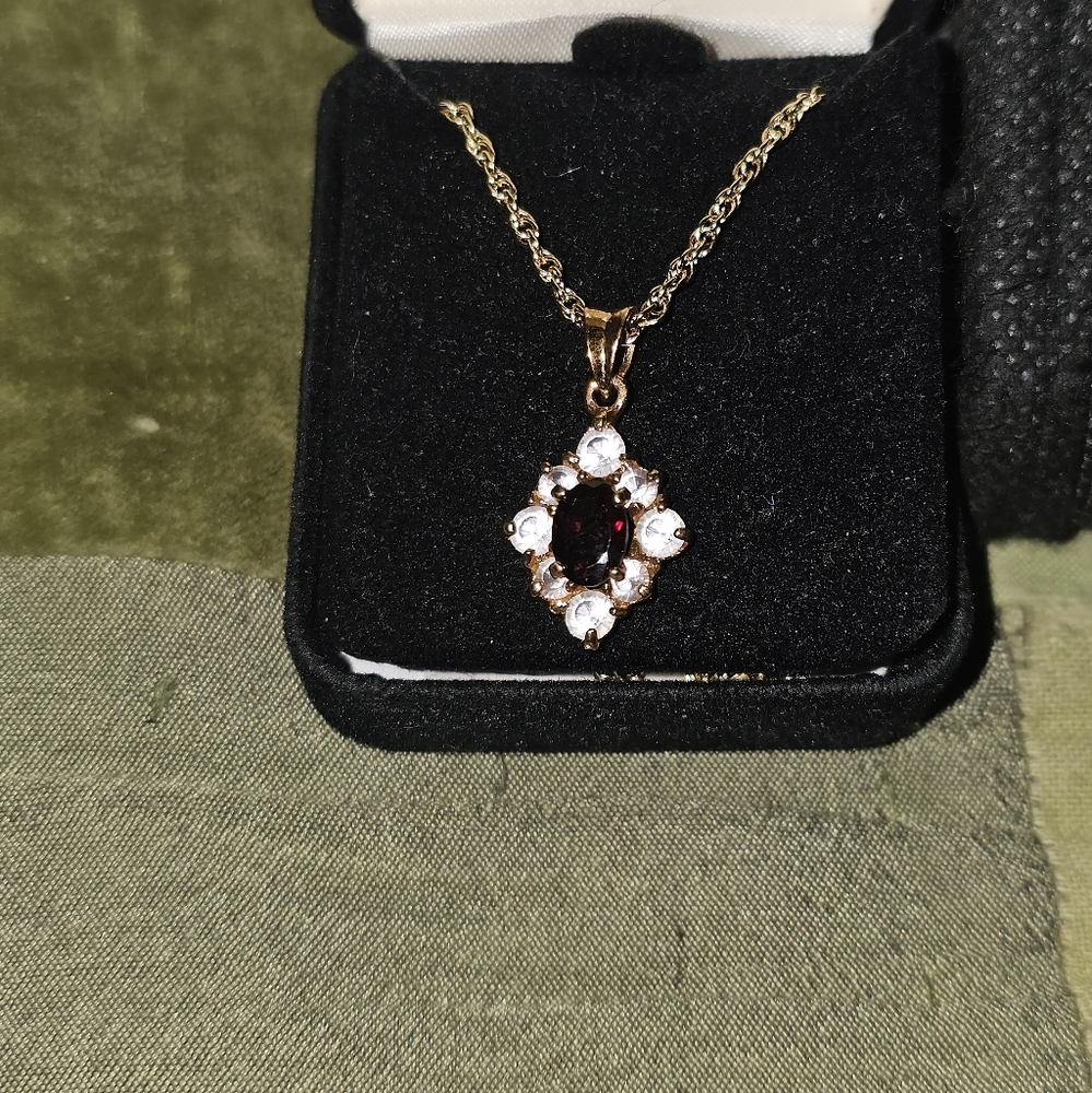 Certificate of authenticity Gold necklace/chain (16") w/ garnet & crystal charm.